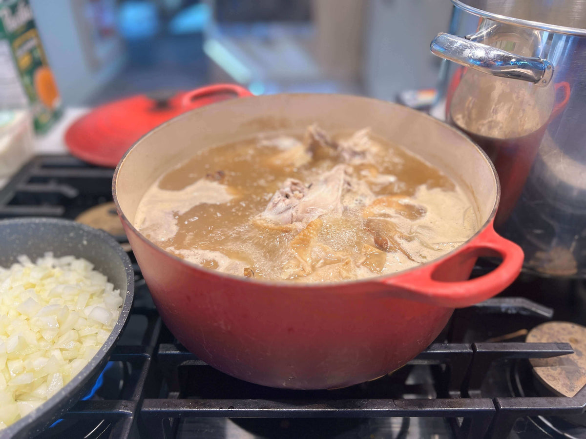 Chicken Noodle Soup steaming on the stovetop.