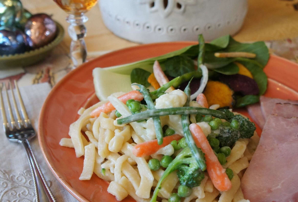 Noodles with vegetables on a table