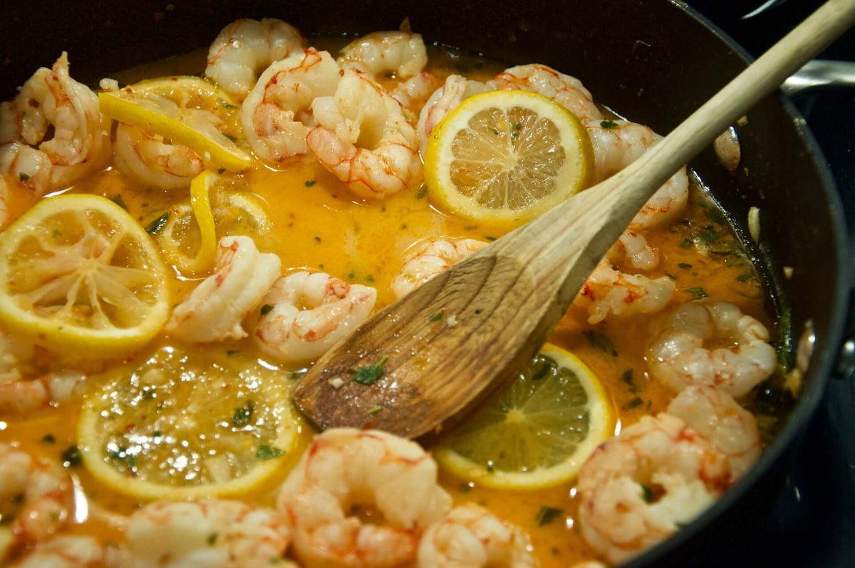 Shrimp in steaming soup with egg noodles