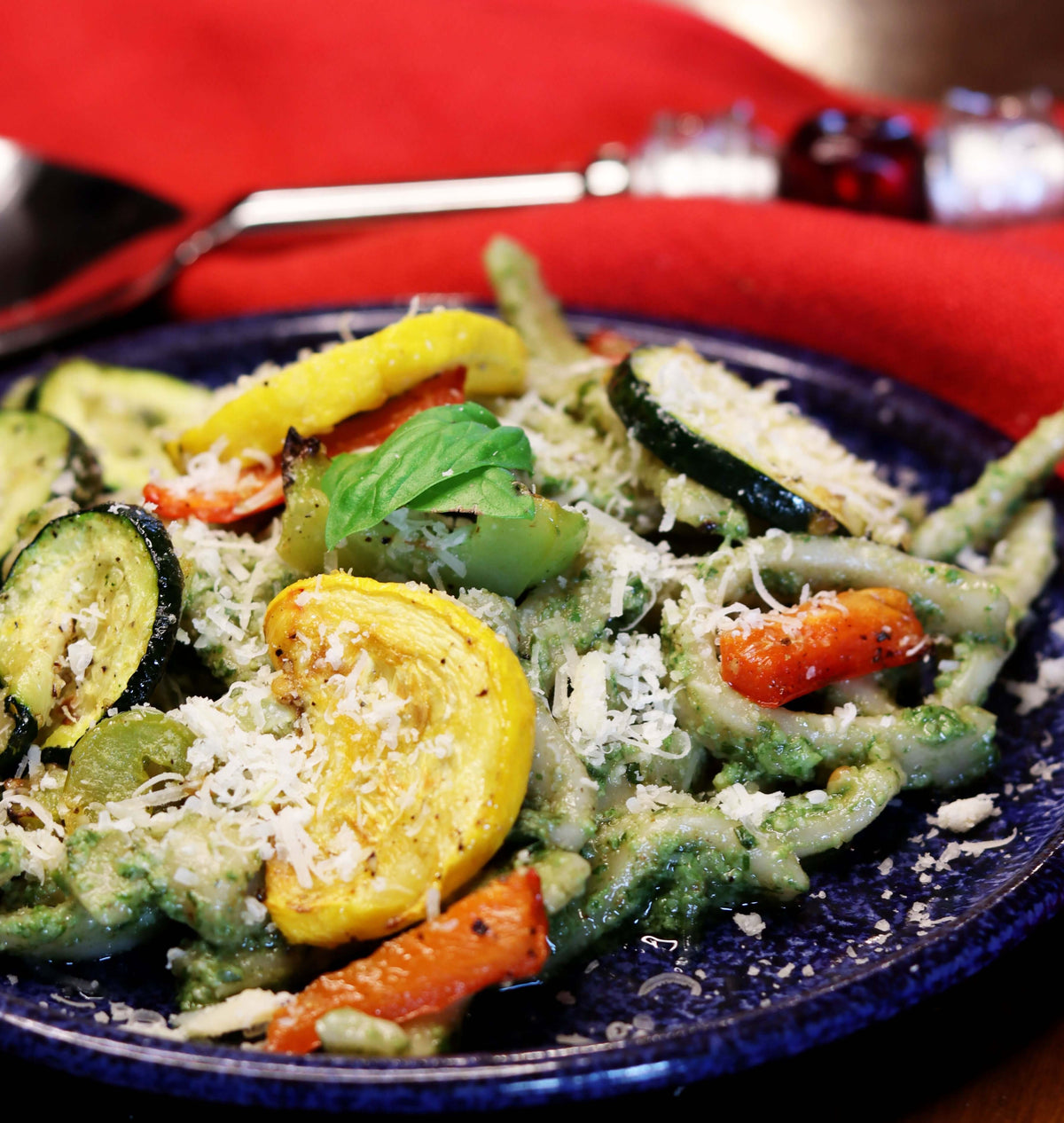 Pesto and roasted veggies with parmesan cheese sprinkled on top. 