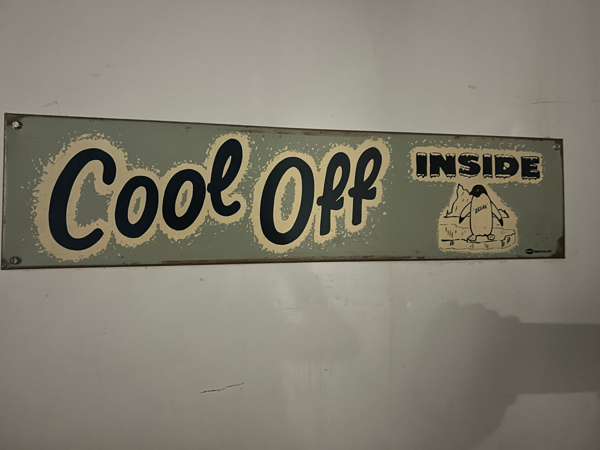 An original 1960's sign on Grandma's freezer saying "Cool Off Inside".