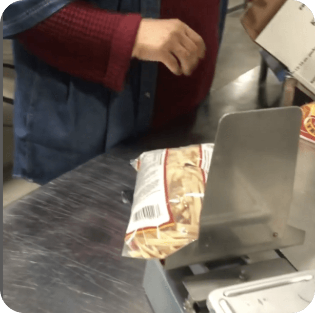 Hand bagging Grandma's Frozen Noodles.