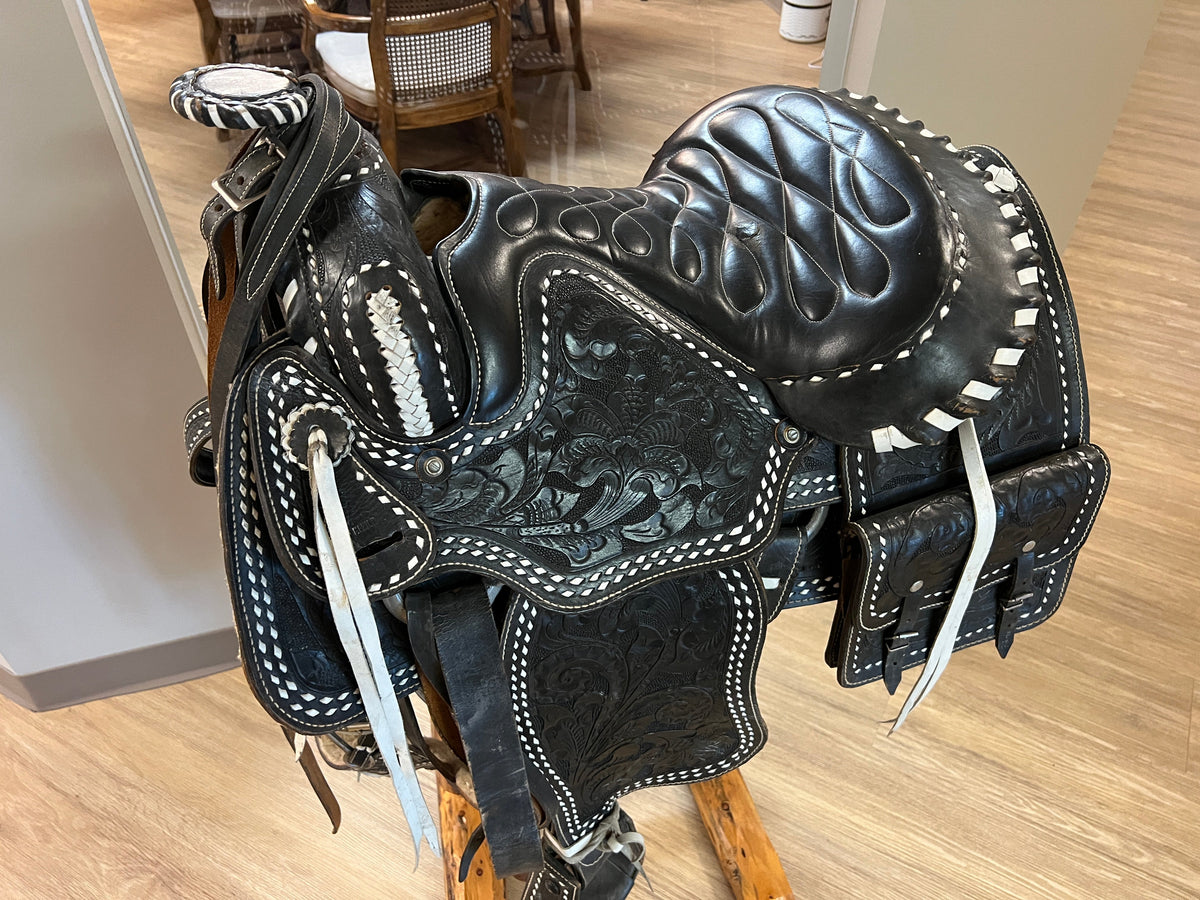 Black leather western style saddle at Grandma's headquarters.