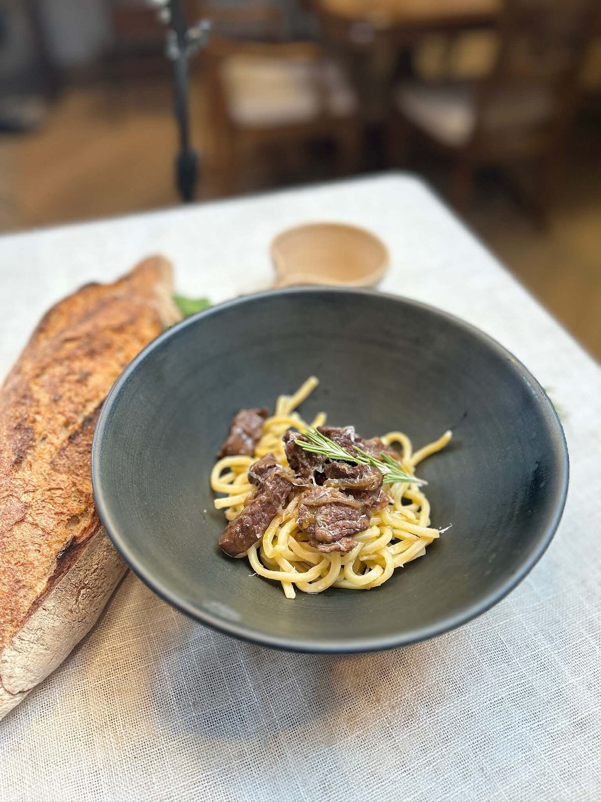 Grandma's noodles with beef stew and parmesan cheese.